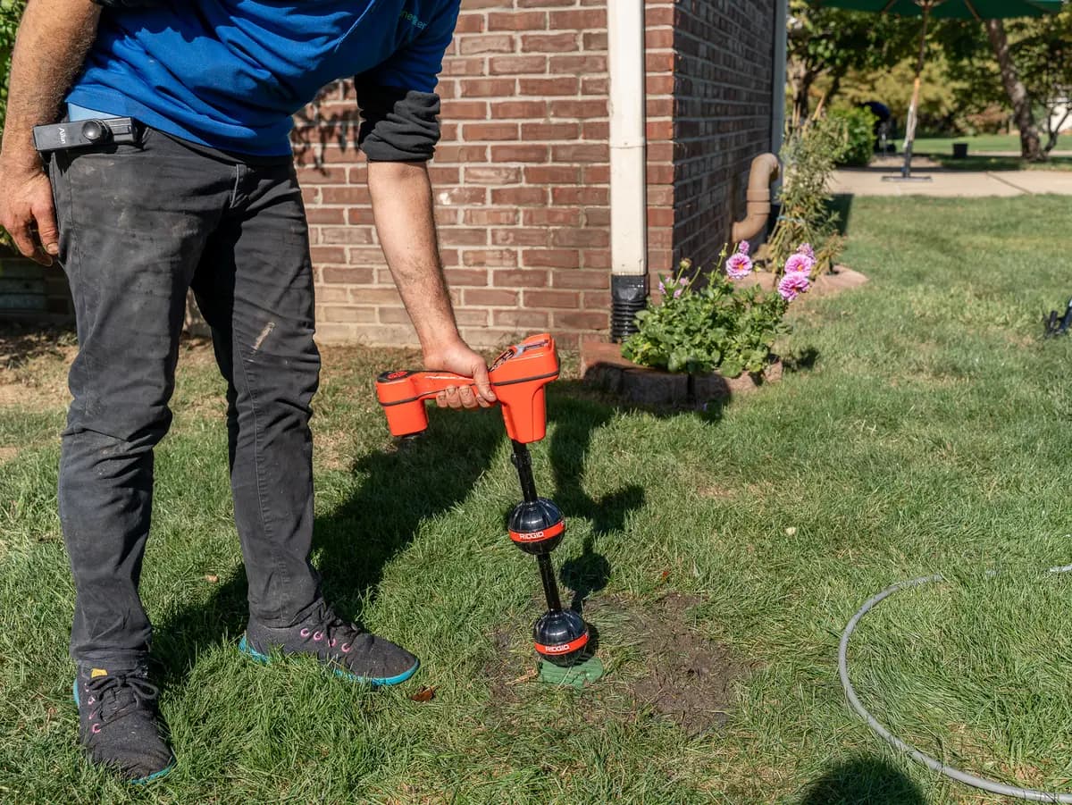 Using radio locator to find buried drain cap